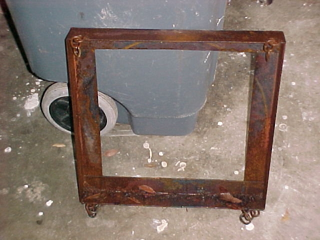 recycling the old furnace top angle iron into a frame for a reverb furnace.jpg
